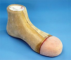 Thermoplastic safety toe box over leather lining on modified shoe last